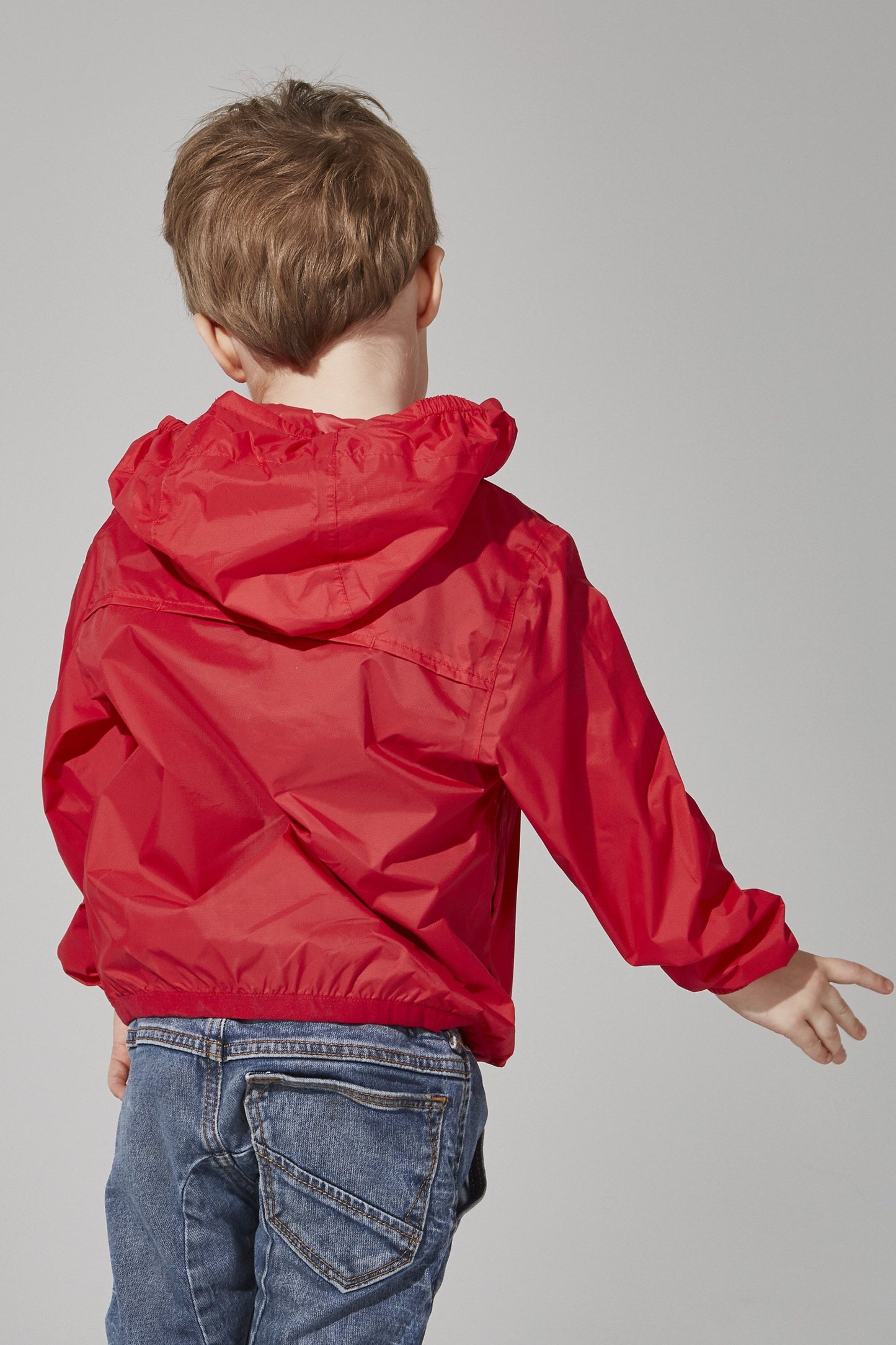 Kids red full zip packable rain jacket and windbreaker