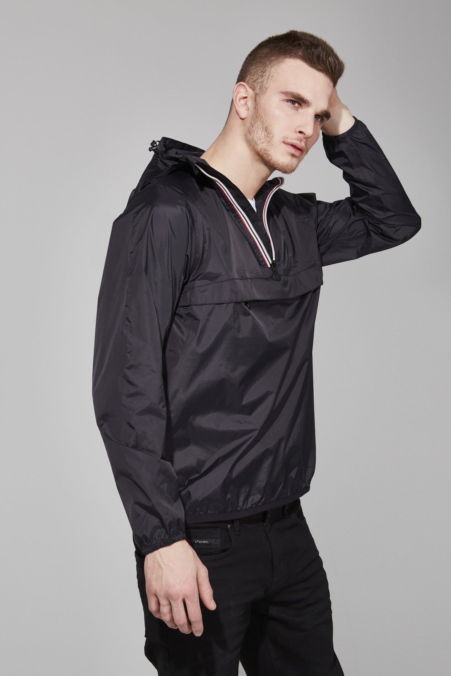 Quarter zip packable light rain jacket and windbreaker in black
